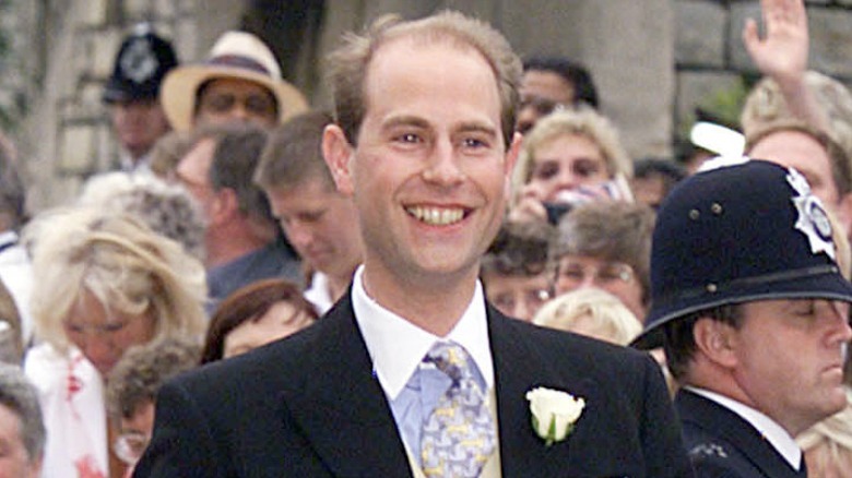 Prince Edward smiling and walking