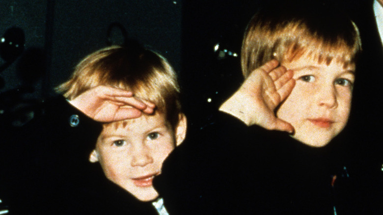 Young Prince Harry and Prince William waving