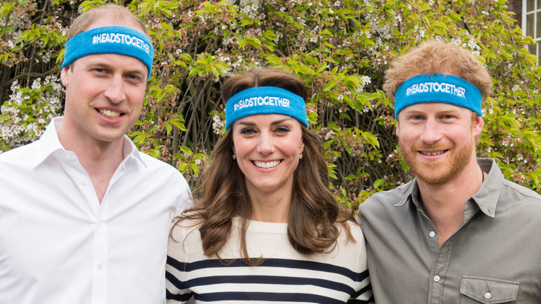 Prince Harry standing with Prince William