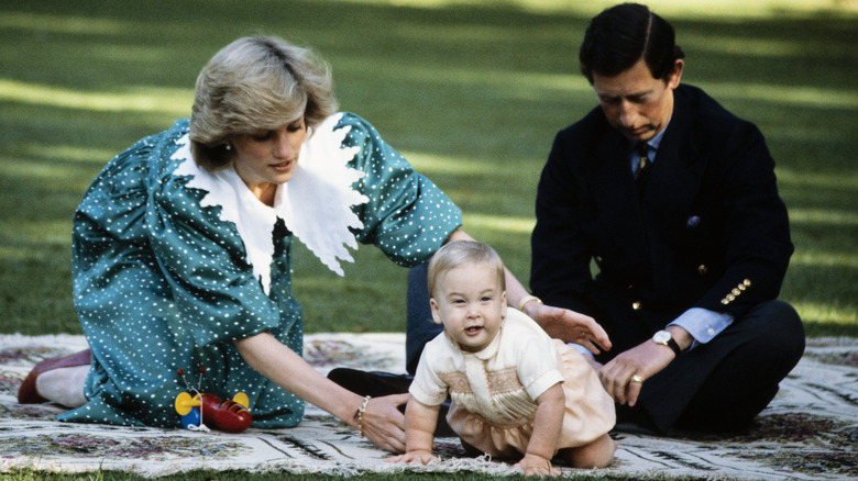 Princess Diana and King Charles holding baby Prince William