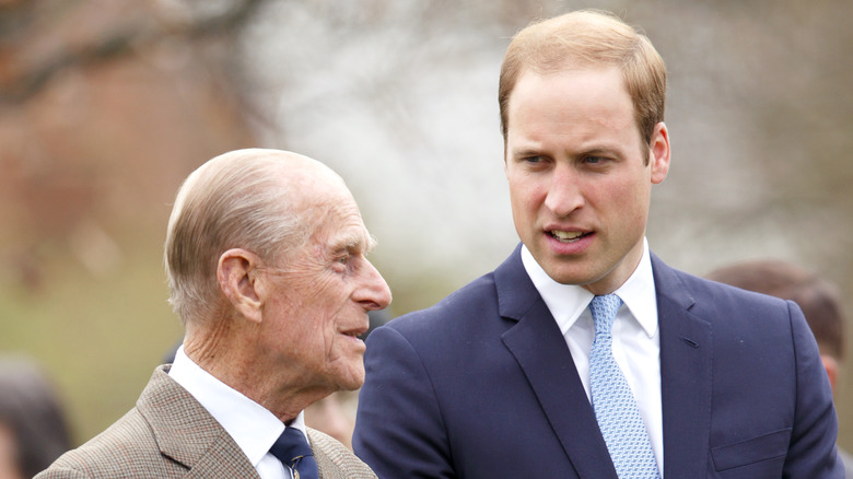 Prince William speaking to Prince Philip