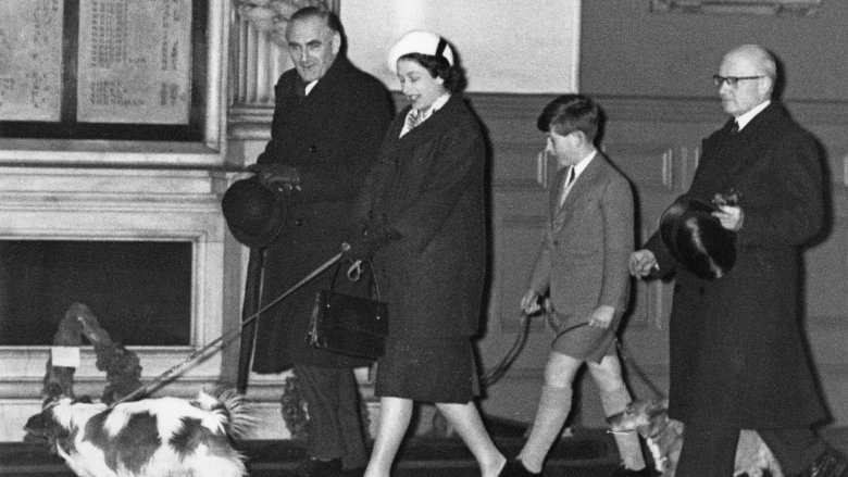 Pregnant Queen Elizabeth II walking a dog