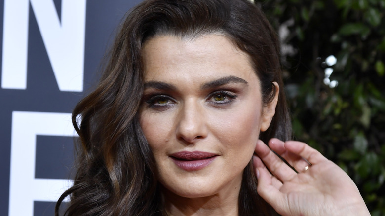 Rachel Weisz tucks her hair