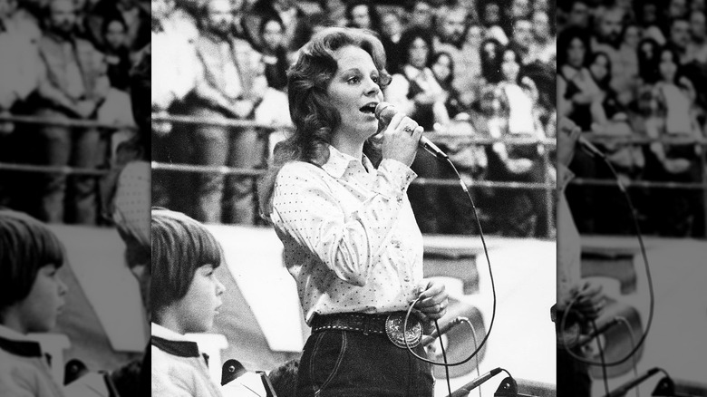 Black-and-white photo Reba McEntire singing