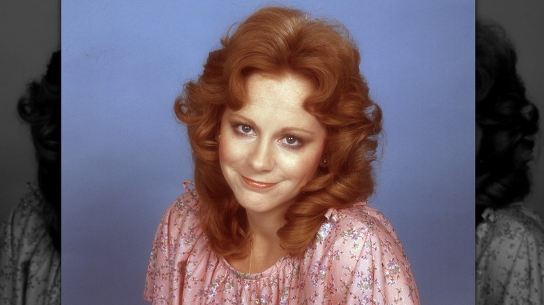 20-something Reba McEntire smiling