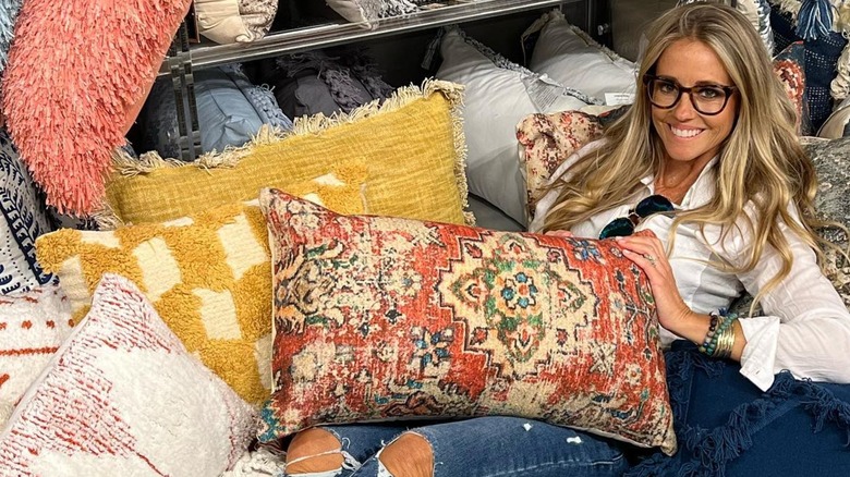 Nicole Curtis posing in a pile of pillows