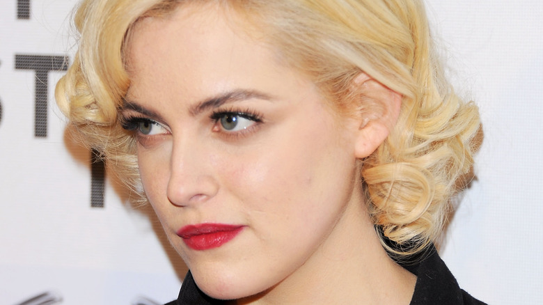 Riley Keough with short blond hair