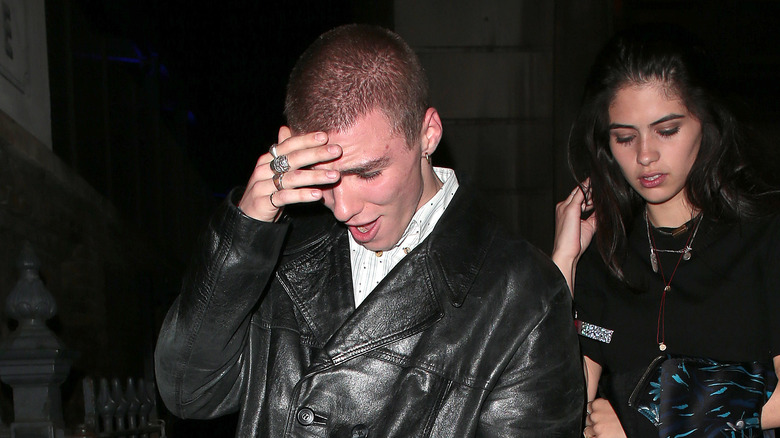 Rocco Ritchie shielding face from camera