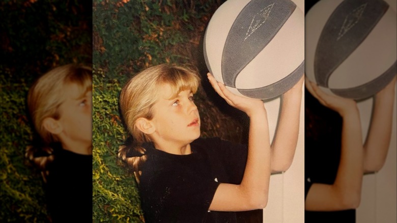 Young Samantha Ponder holding a basketball