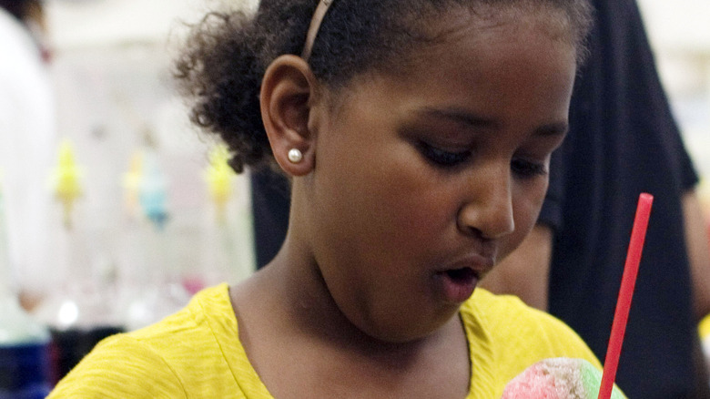 Sasha Obama as a child eating ice cream