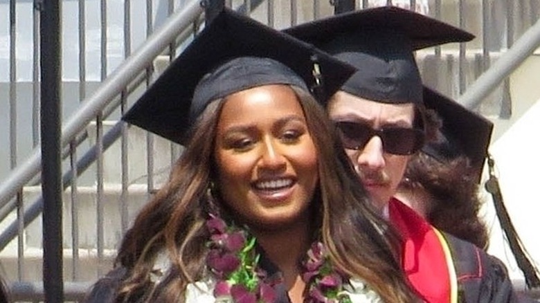 Sasha Obama smiling in graduation cap and gown