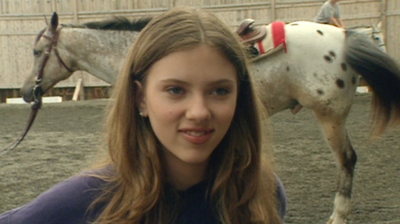 Scarlett Johansson with a horse in 1998