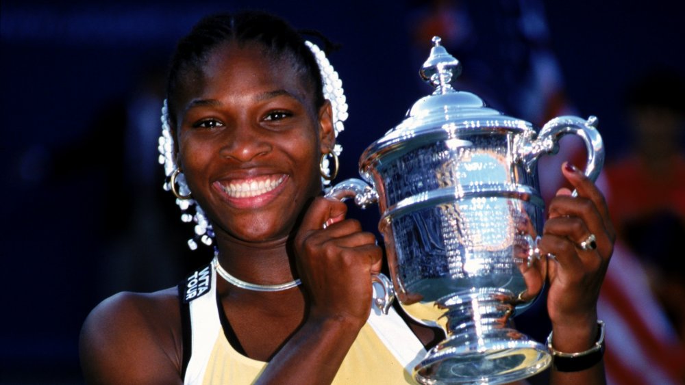 Serena Williams with a trophy in 1999