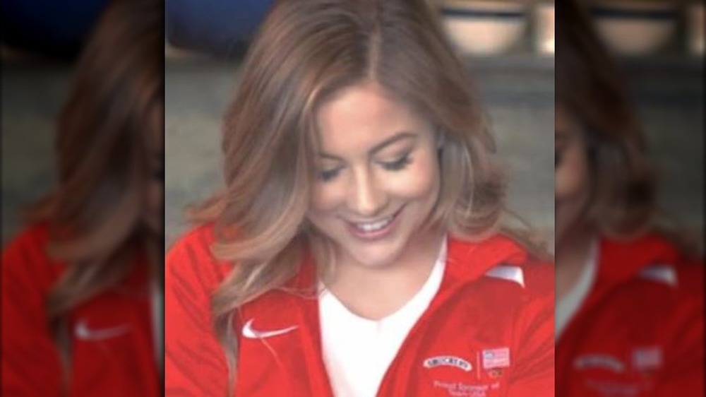 Shawn Johnson smiling, looking down