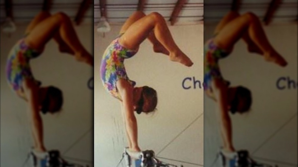 Young Shawn Johnson doing a handstand