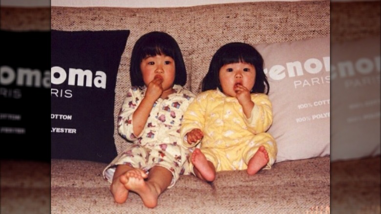 Anna Sawai and Reina Sawai sitting on a couch