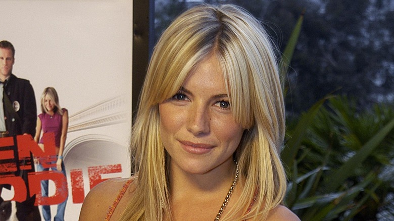 Young Sienna Miller looking into camera