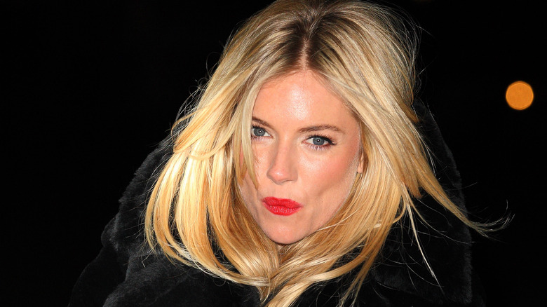 Sienna Miller in black fur