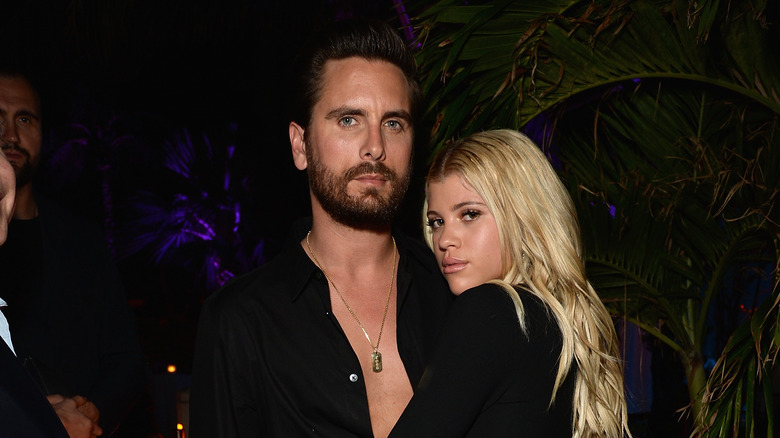 Sofia Richie and Scott Disick posing 