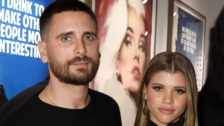 Sofia Richie and Scott Disick posing 