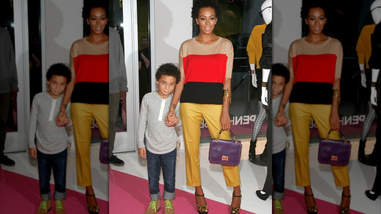 Julez Smith holding Solange Knowles' hand at Open House Gallery in New York