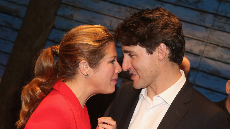 Sophie Grégoire and Justin Trudeau speak closely