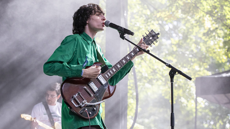 Finn Wolfhard playing guitar