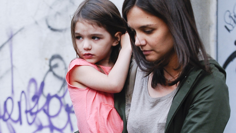 Suri Cruise and Katie Holmes together somber medium shot