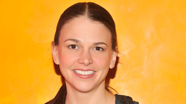 Sutton Foster on a yellow background