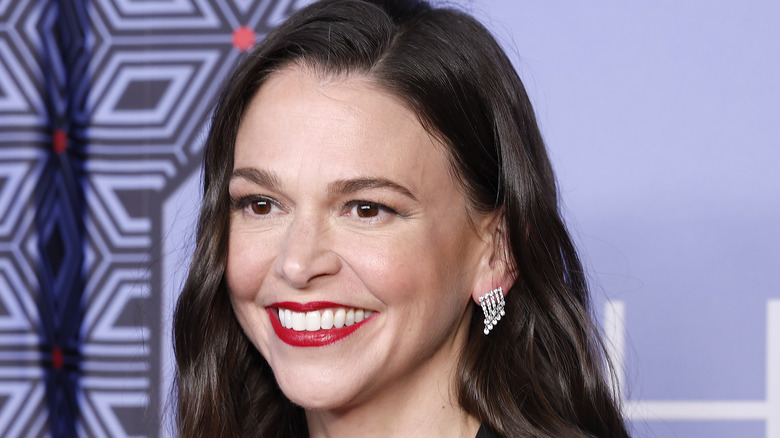 Sutton Foster smiling with red lipstick