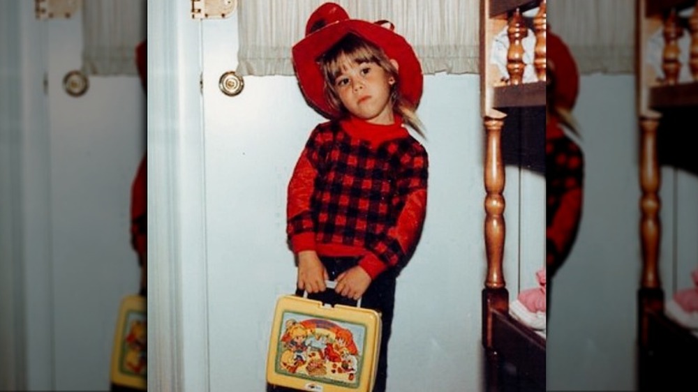 Young Tara Lipinski with a lunchbox