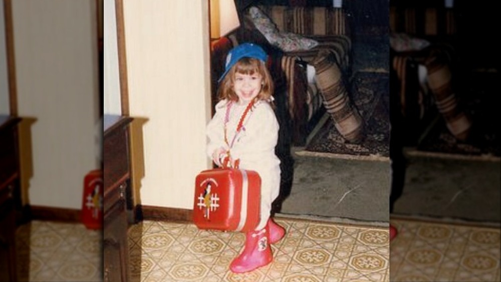 Young Tara Lipinski with a purse