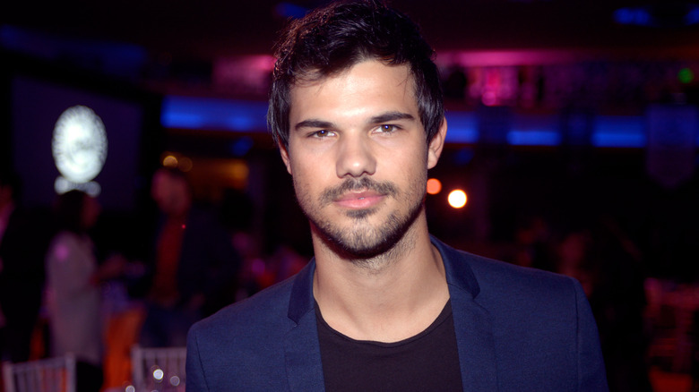 Taylor Lautner smolders at camera