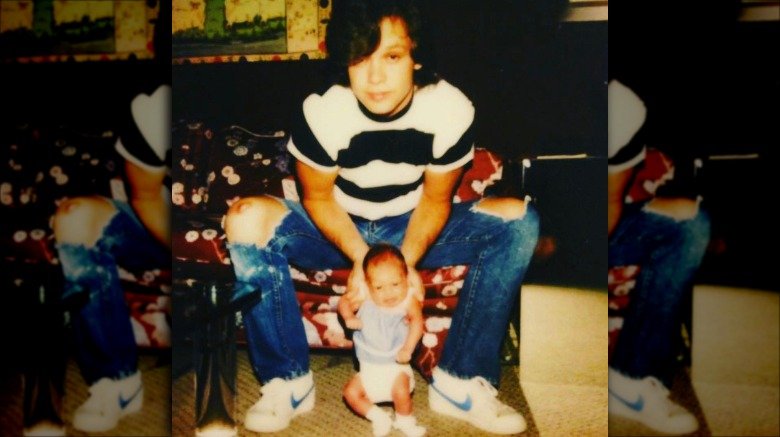 Teddi Jo Mellencamp as a baby and her father John Mellencamp