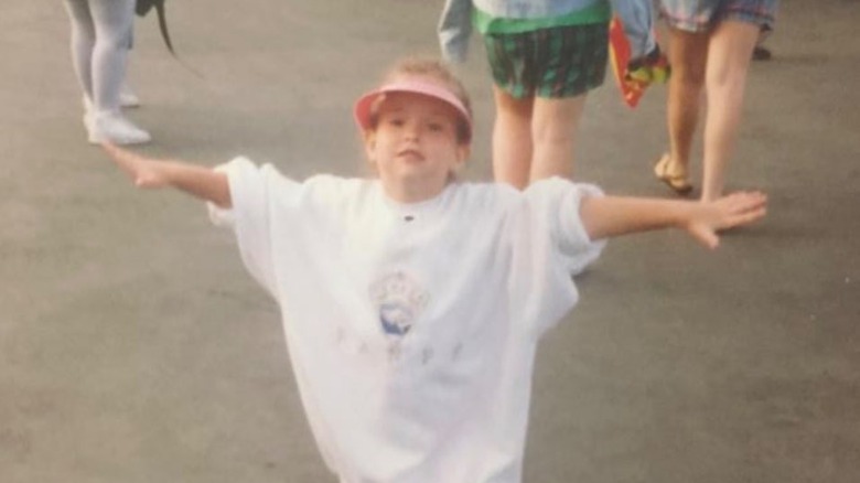 Young Milana Vayntrub wearing a hat