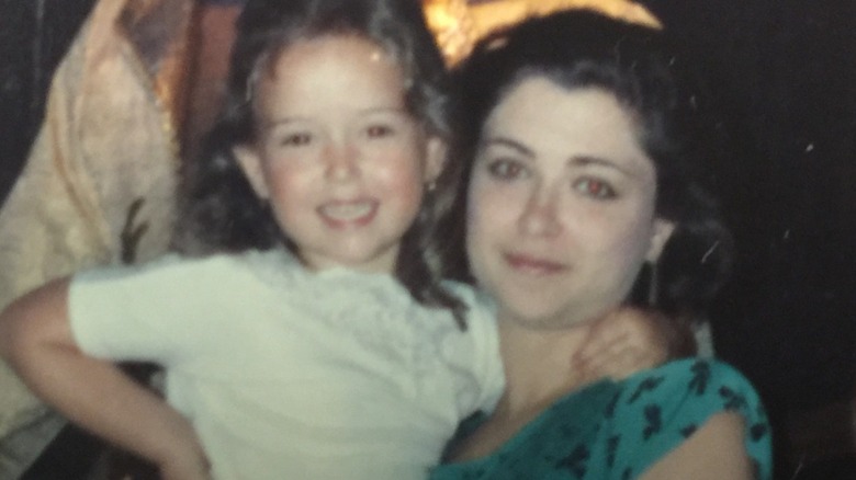 A young Milana Vayntrub, her mother