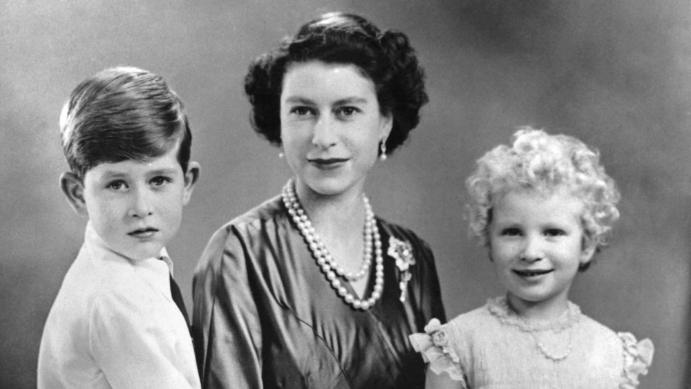 Princess Anne, Prince Charles, and Queen Elizabeth