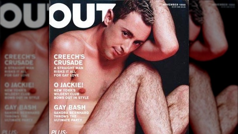 Alan Cumming, posing in the buff on the cover of Out Magazine