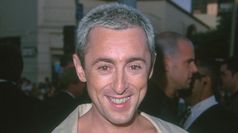 Alan Cumming wearing eyeliner and spiky hair