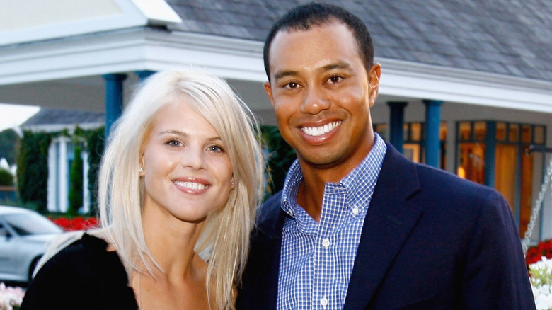 Elin Nordegren smiling with Tiger Woods