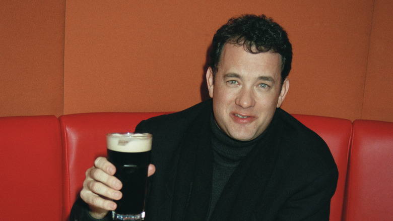 Tom Hanks holding a drink