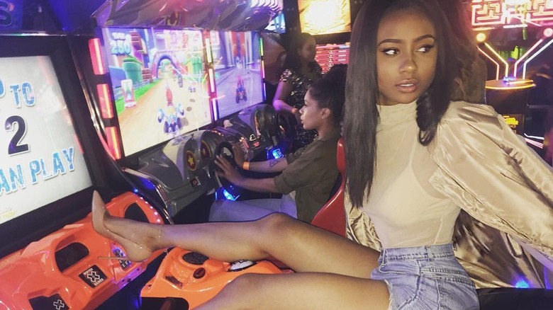 Kayla Nicole posing in an arcade