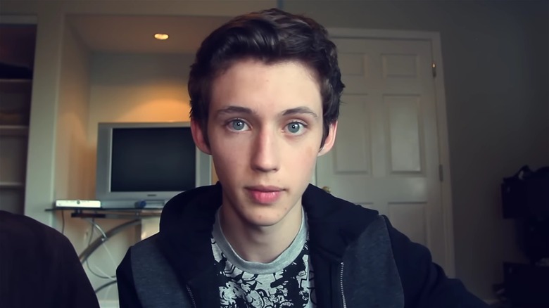 Troye Sivan looking into webcam