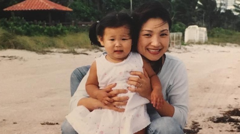 Young Chloe Kim, mom at beach