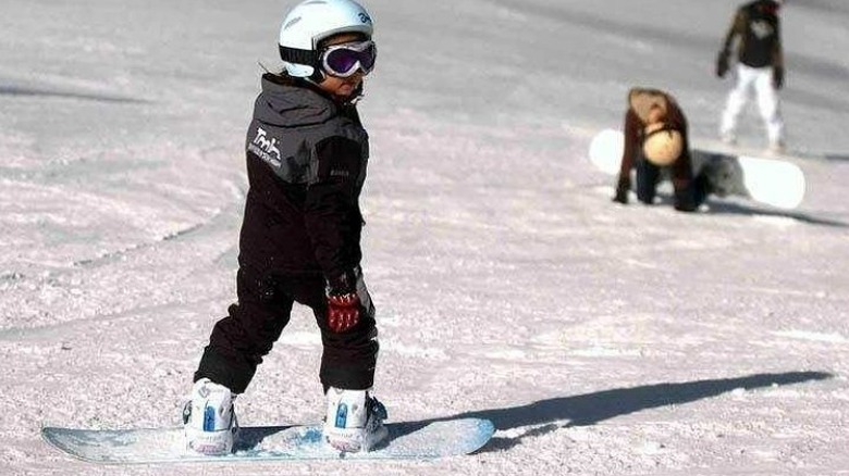 Young Chloe Kim snowboarding