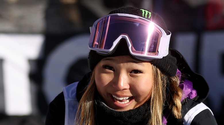 Chloe Kim smiling in gear, 2021