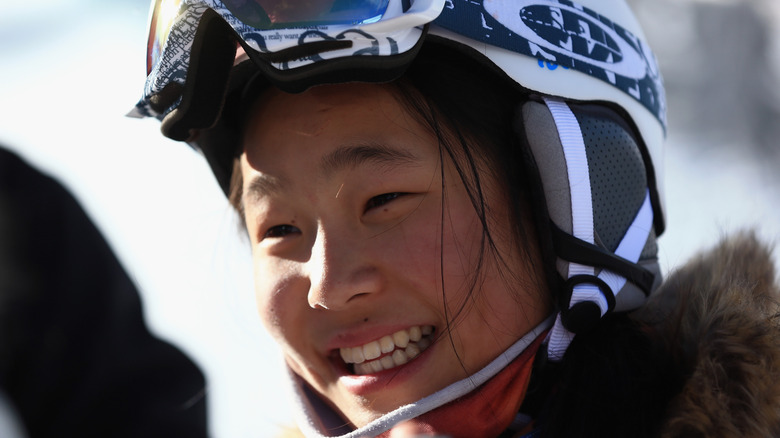 Chloe Kim in helmet, smiling