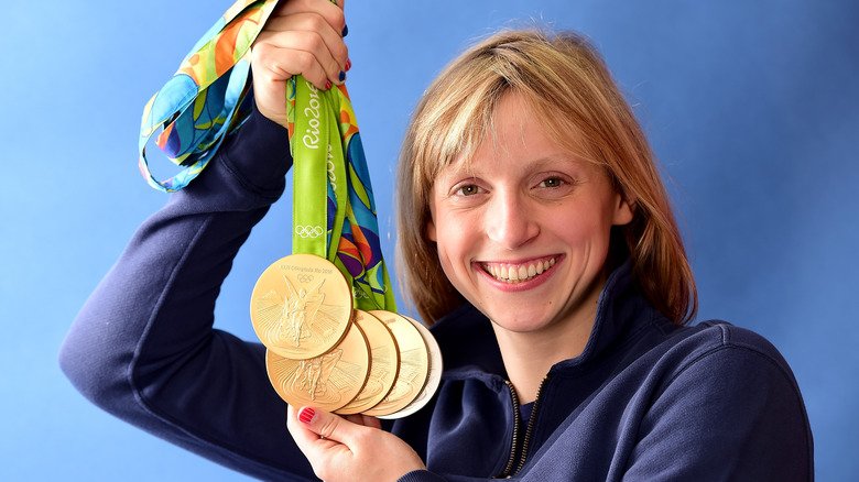 Katie Ledecky showing off her medals at 2016 Olympics