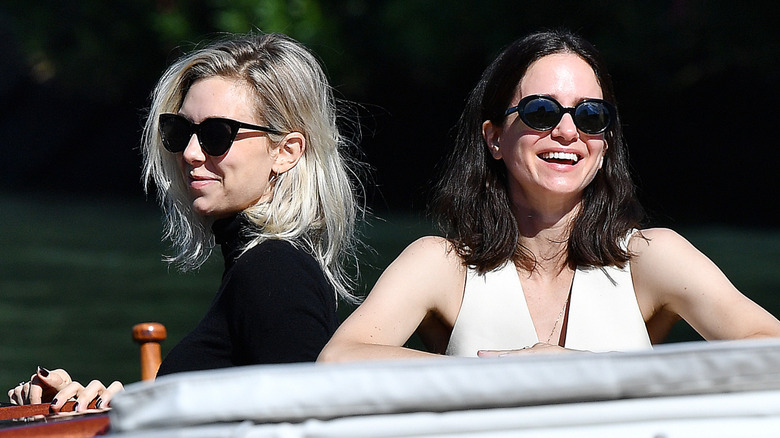 Vanessa Kirby and Katherine Waterston smiling on a boat