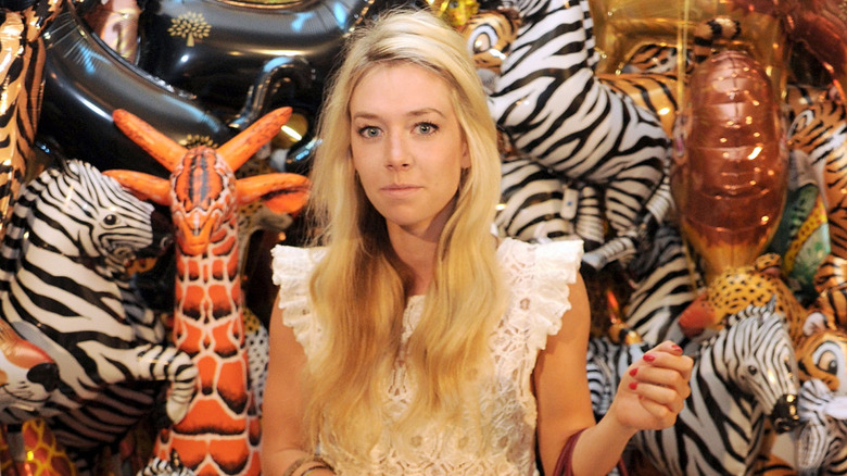 Vanessa Kirby posing in front of balloon animals